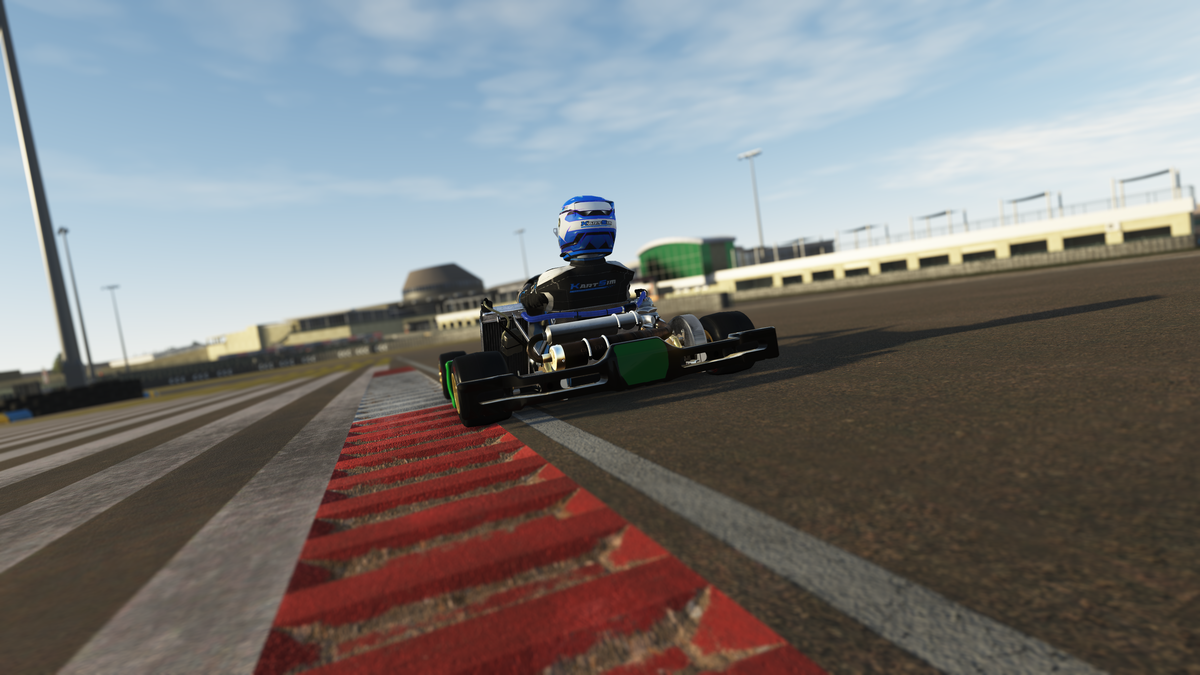 Young driver training on a KartSim Pro simulator with laser-scanned circuits, realistic kart physics, and coaching to develop confidence and racing skills.