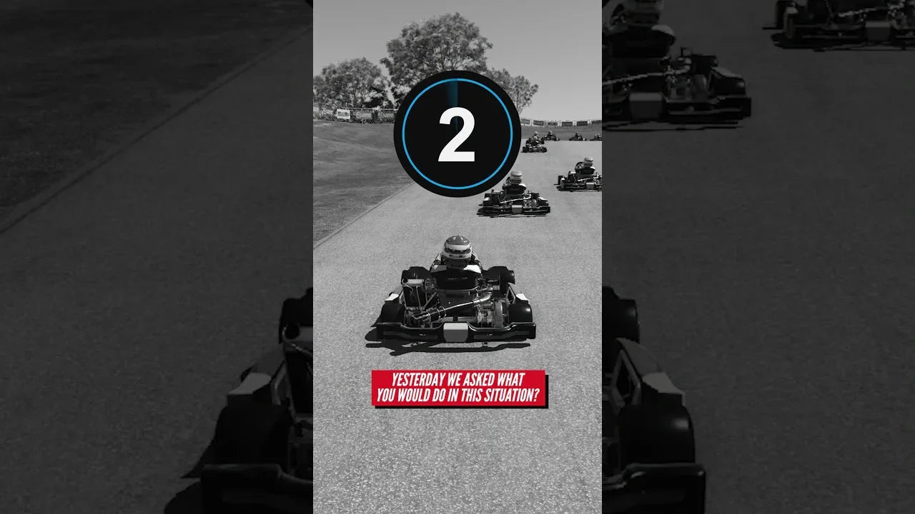 Multiple kart drivers racing closely on a realistic karting track for professional driver training.