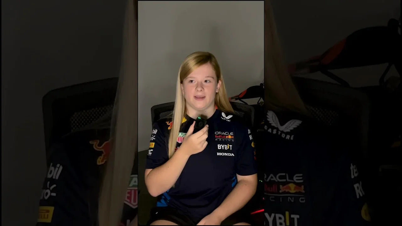 Driver receiving professional kart coaching on a KartSim Pro simulator using laser-scanned tracks and telemetry-based analysis for performance improvement.