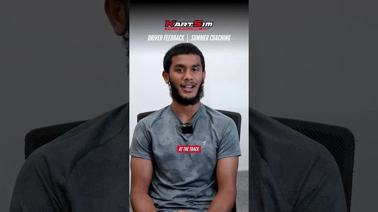 Karting driver in training session discussing kart driver feedback and simulator coaching.