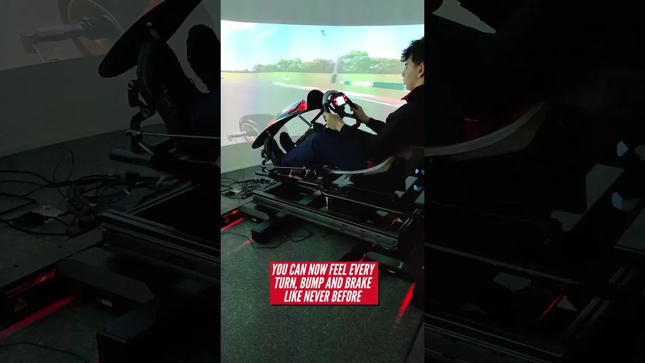 Driver training in a professional kart simulator rig with realistic racing interface and pedal setup.