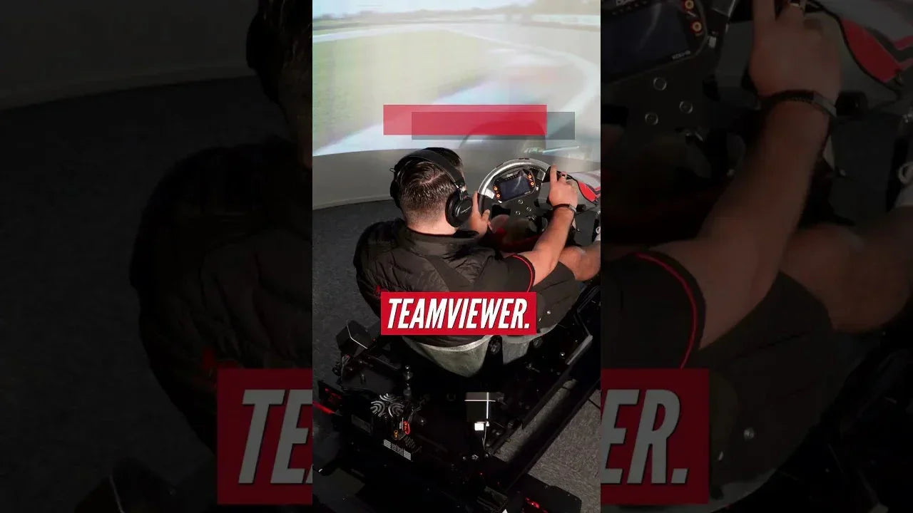 Driver using professional kart racing simulator rig with realistic seating, wheel, pedals, and projection track for training.