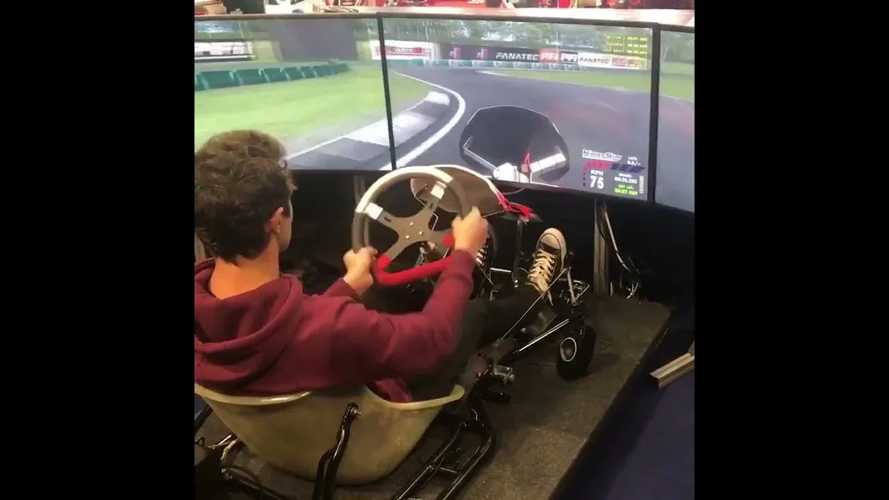 Driver training on a KartSim Pro karting simulator demonstrating karting foundations used in elite motorsport development