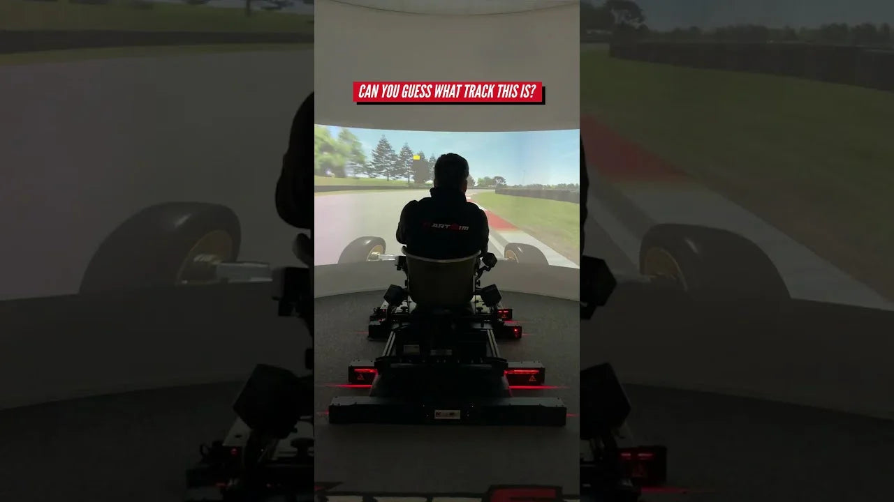 Driver completing a backwards lap challenge on a KartSim Pro simulator using laser-scanned tracks and realistic kart physics.