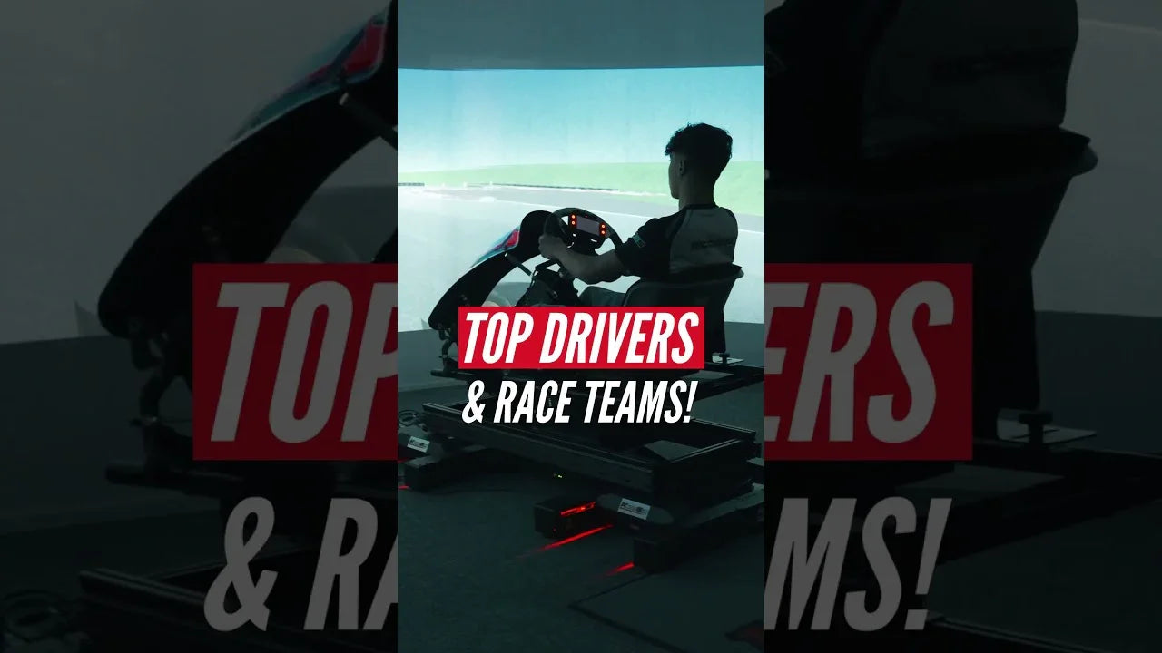 Professional kart racing simulator with driver in realistic seating position, racing interface display