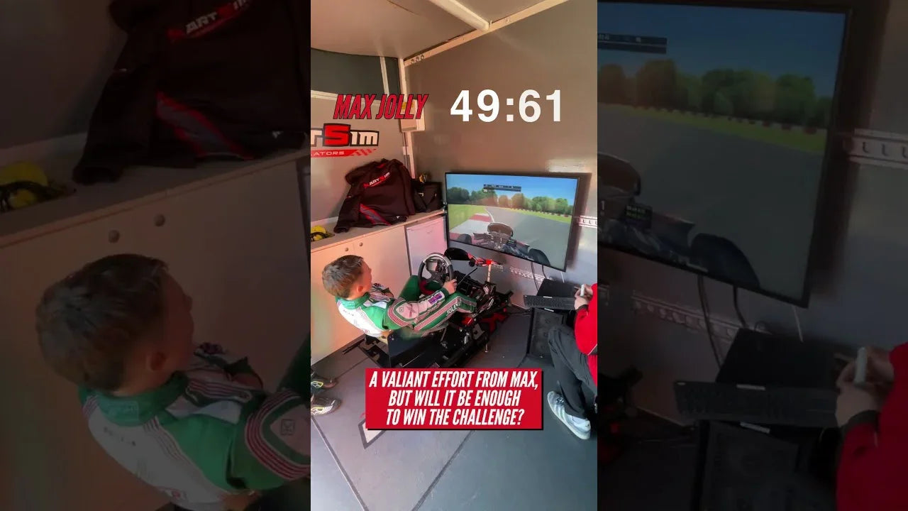 Young driver in kart simulator seat using wheel and pedals for realistic kart racing training