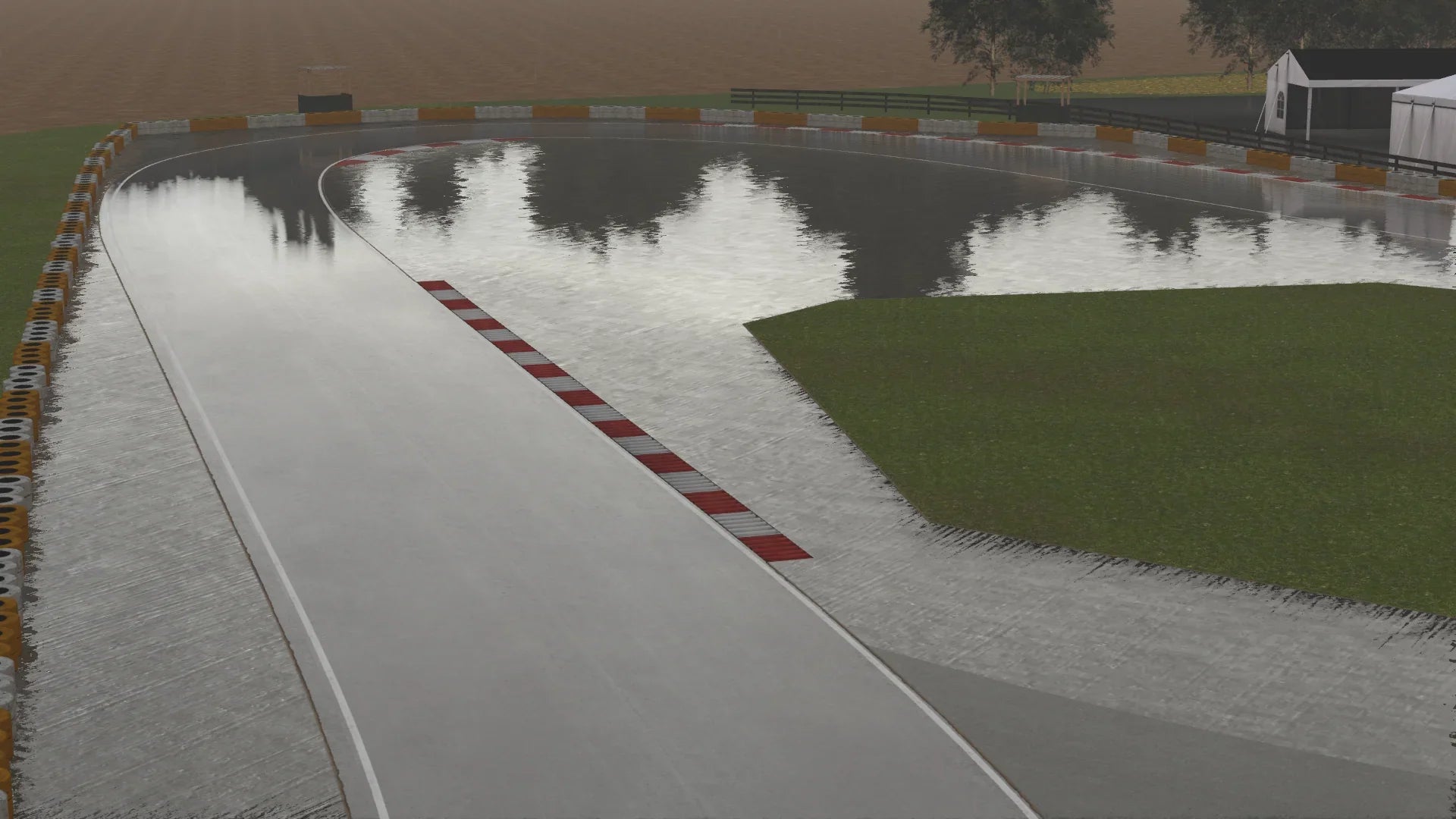 KartSim – High‑speed sweep at Kimbolton in the wet with standing water and sheen across the racing line.