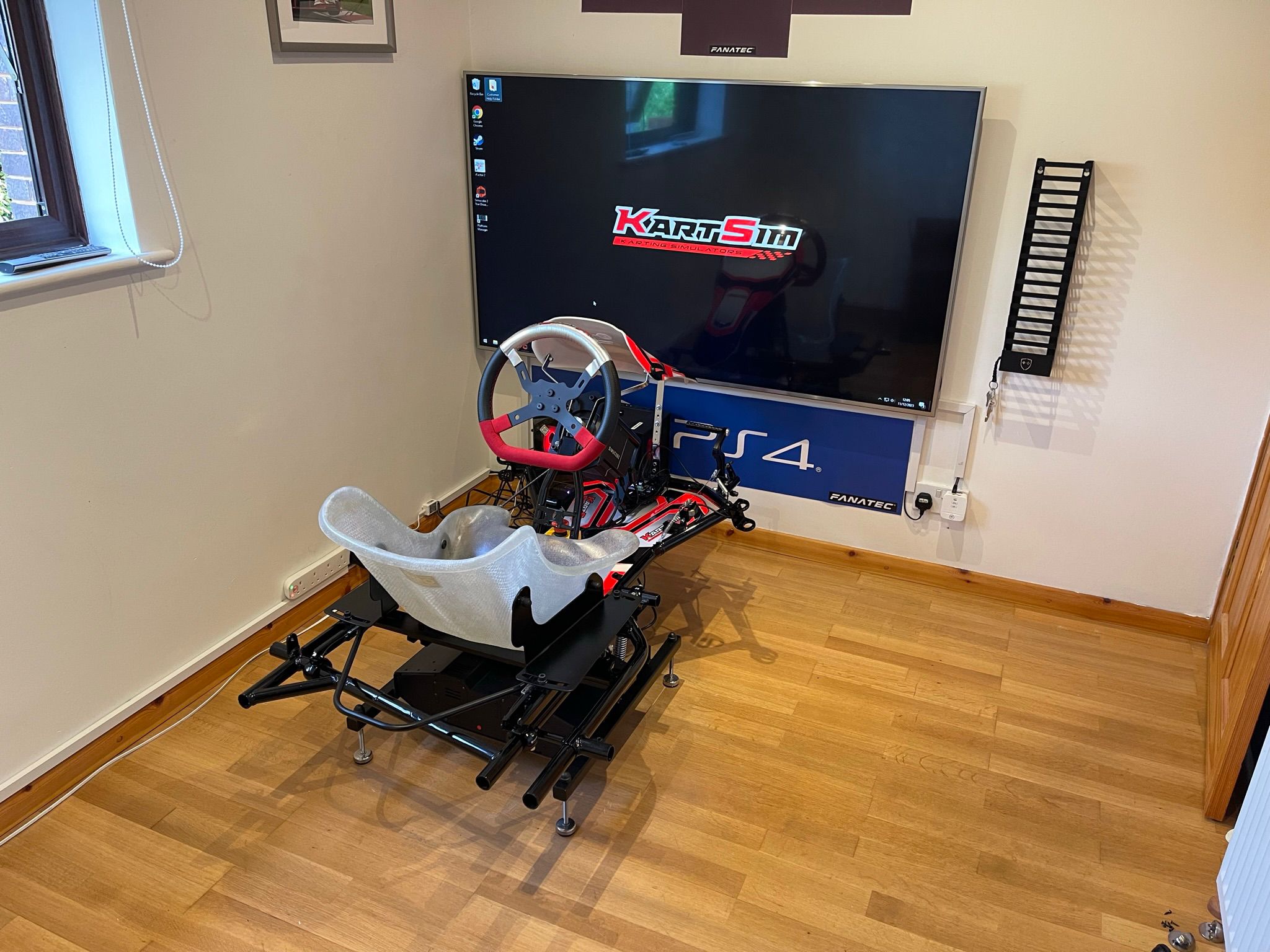 KartSim Pro Simulator mounted on a hardwood floor with clean monitor integration, designed for premium home simulator experiences.