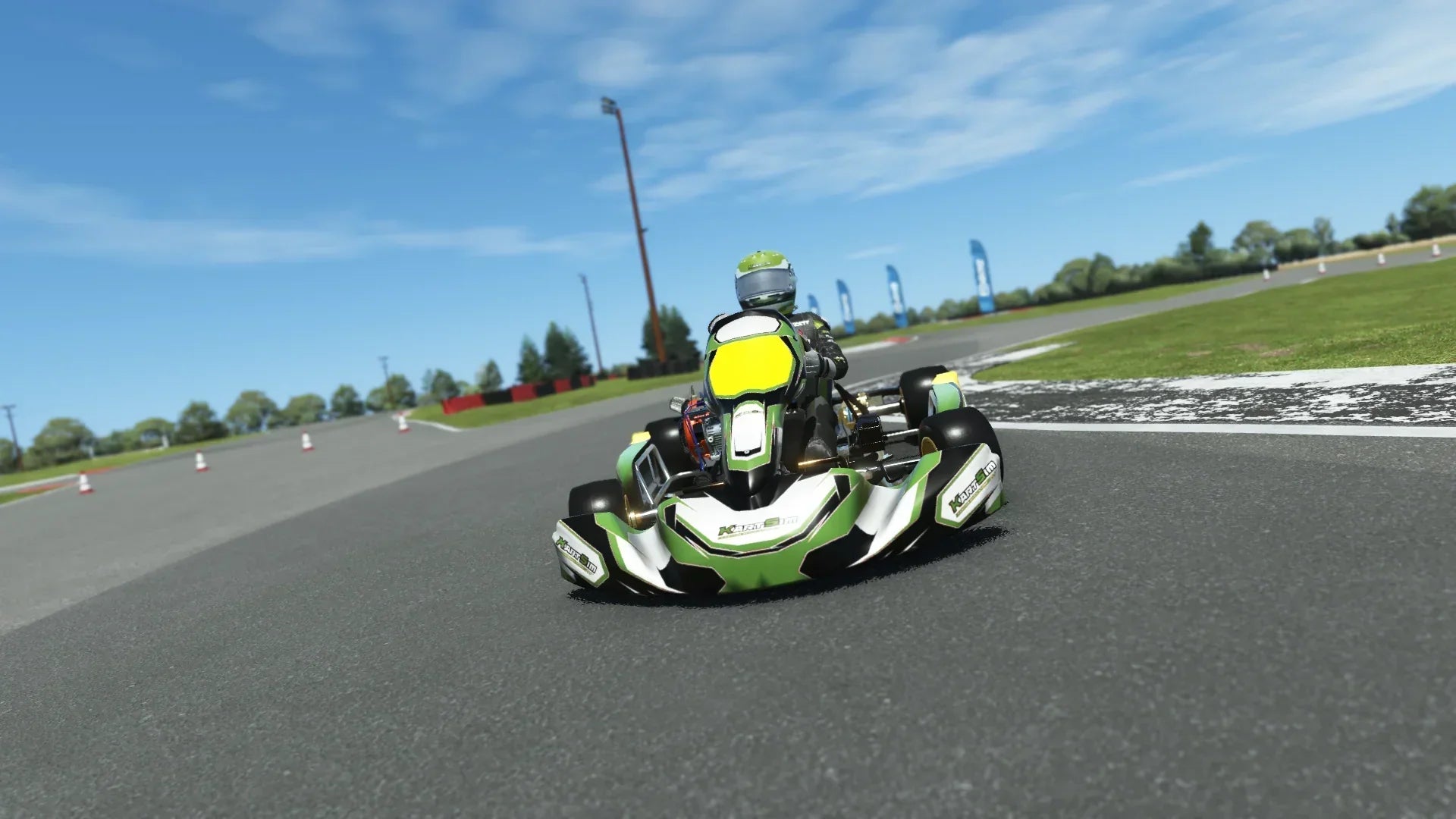 Briggs 206 Junior 007 kart with red, white, and black livery shown on KartSim software racing on kart track with tire barriers