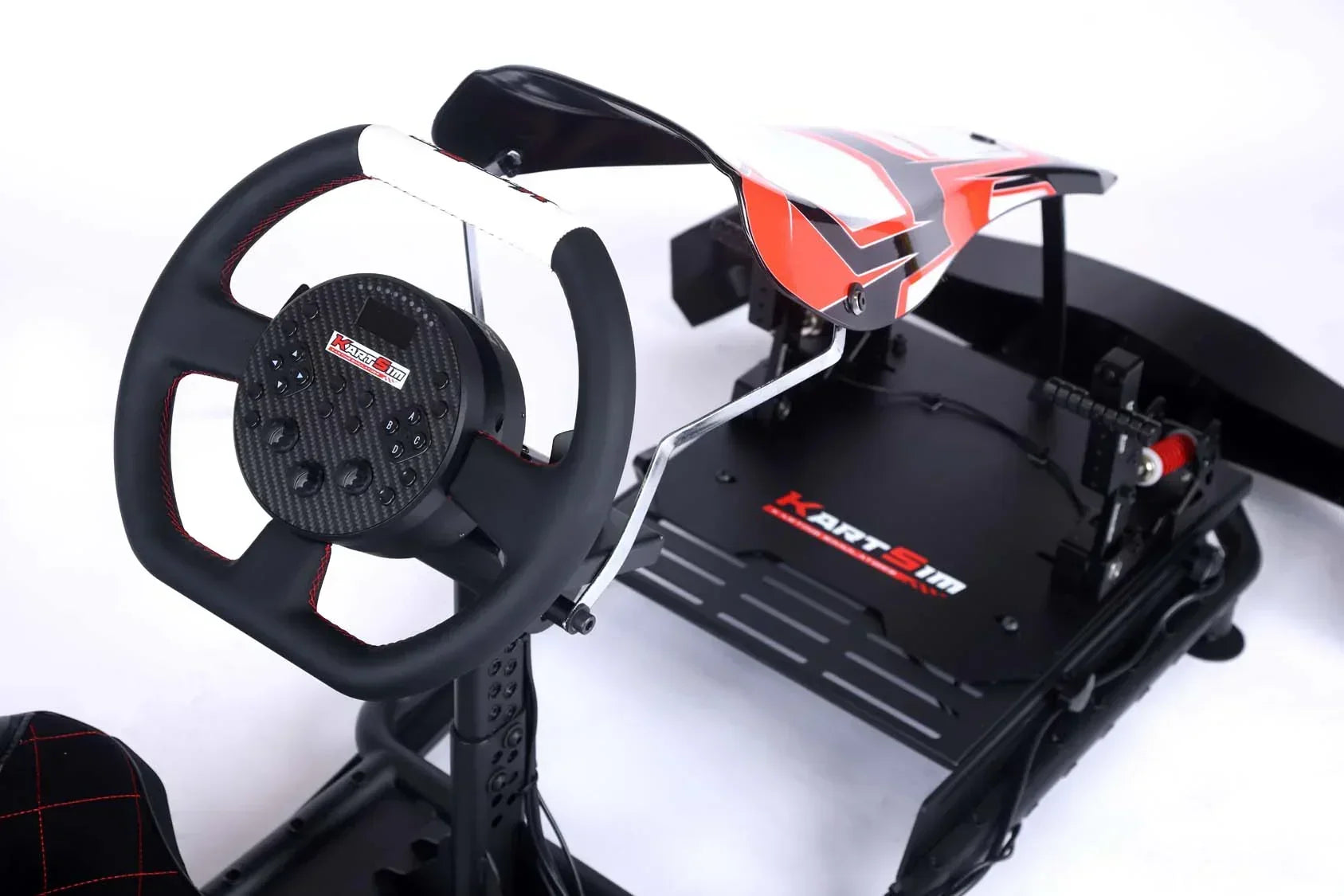 Top view of professional kart simulator rig with adjustable steering wheel, pedals and realistic seating