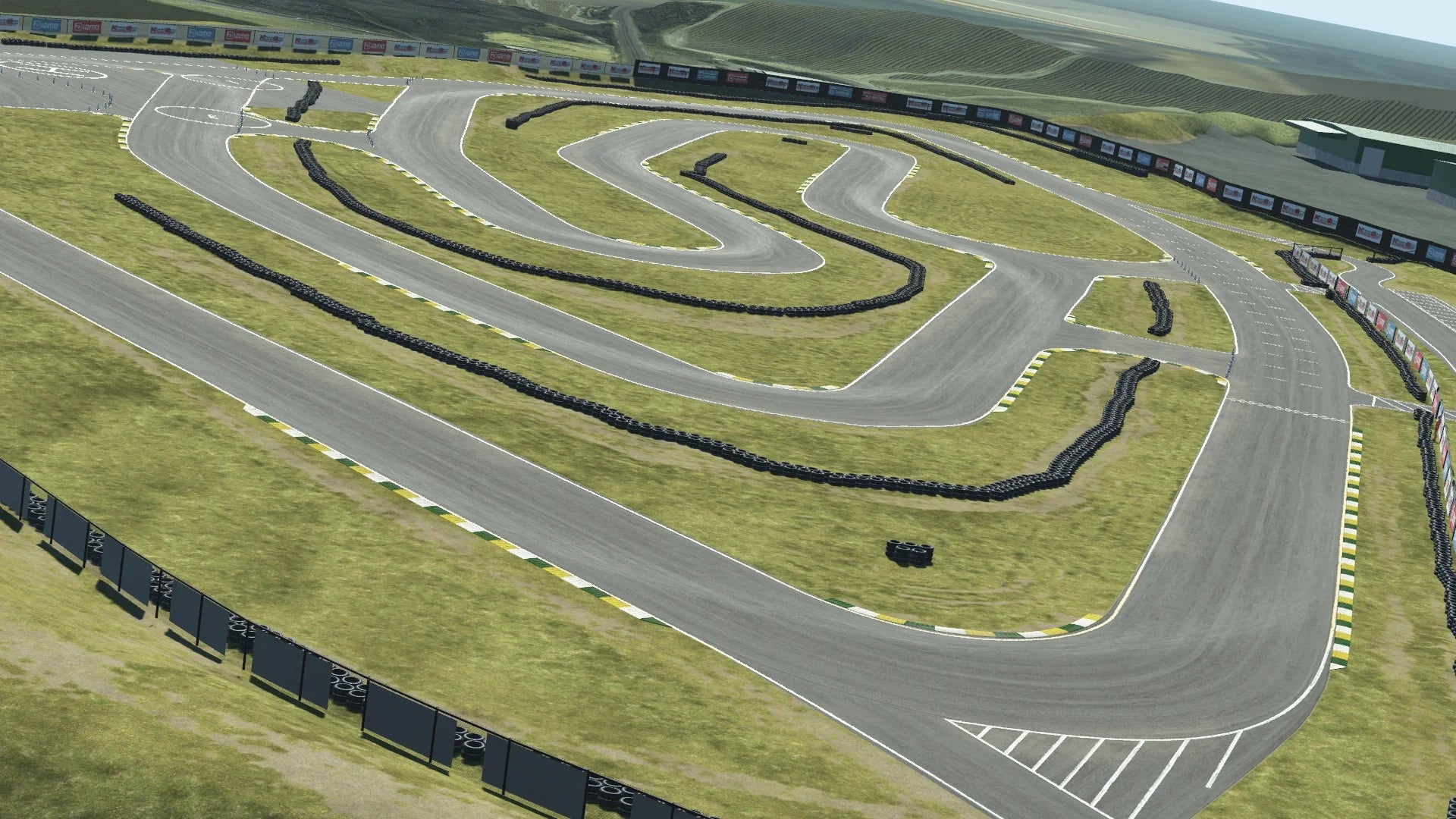 Aerial view of Sonoma karting circuit – tight curves, straights, tire barriers, and green hillside backdrop