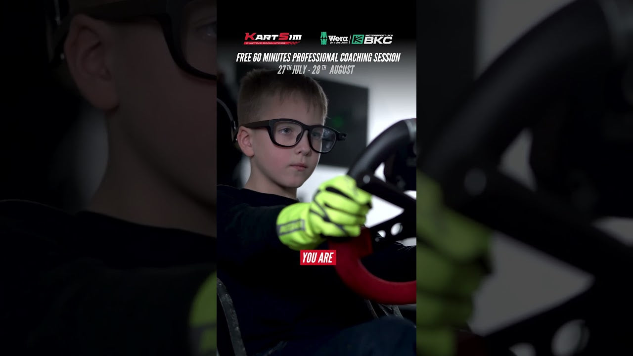 Young kart driver in focused training posture using professional kart simulator with racing gloves and steering wheel