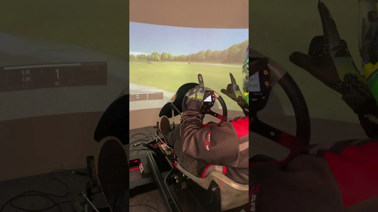 KartSim Pro UK sim racing clip – reminder to keep both hands on the wheel during left turns