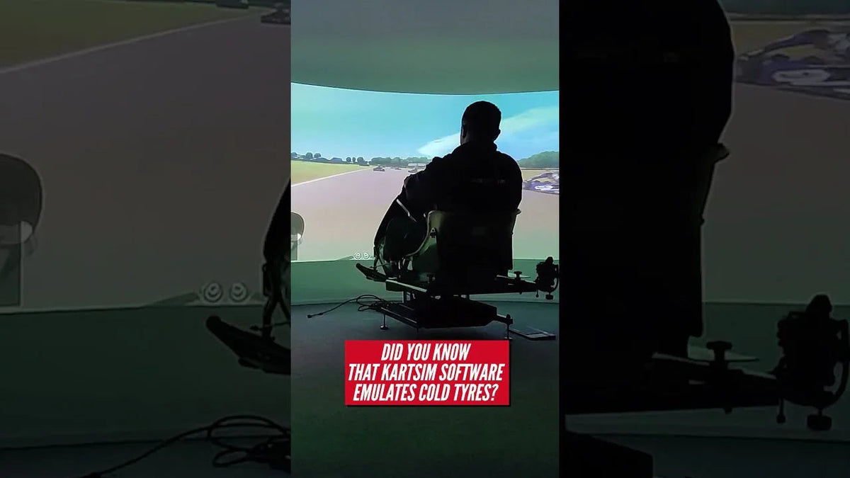 Driver using professional kart racing simulator rig with motion platform and curved screen for realistic karting training.
