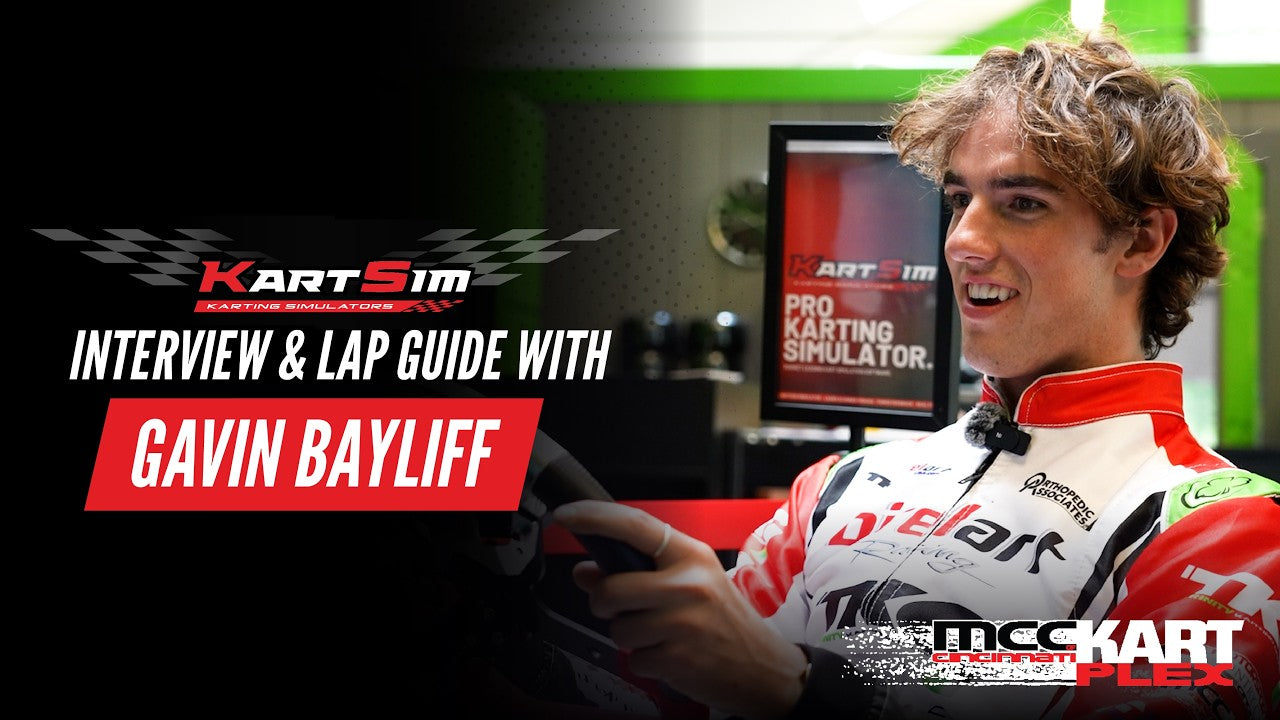 Gavin Bayliff in kart racing suit at KartSim simulator, demonstrating professional kart driver training setup