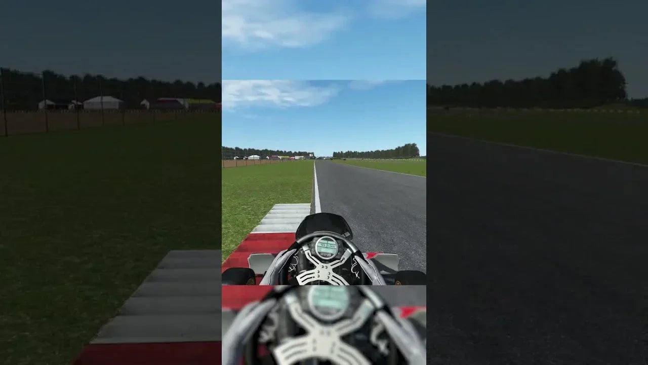 kart simulator cockpit view with digital steering wheel on a realistic racing track for driver training