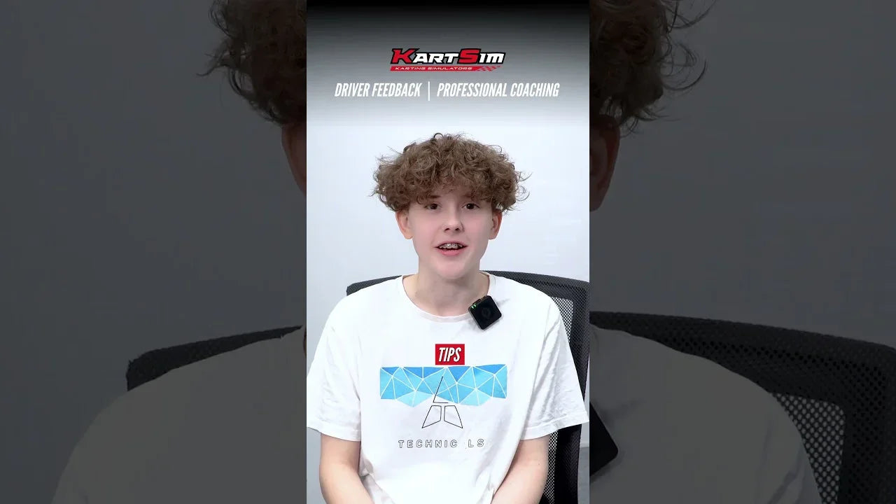 Young kart driver in coaching session, discussing kart simulator training and driver feedback tips.