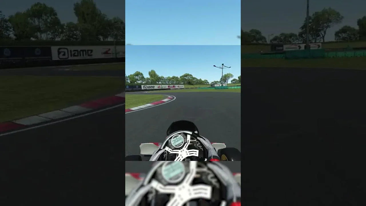 Kart racing simulator cockpit view with detailed digital dashboard on realistic training track
