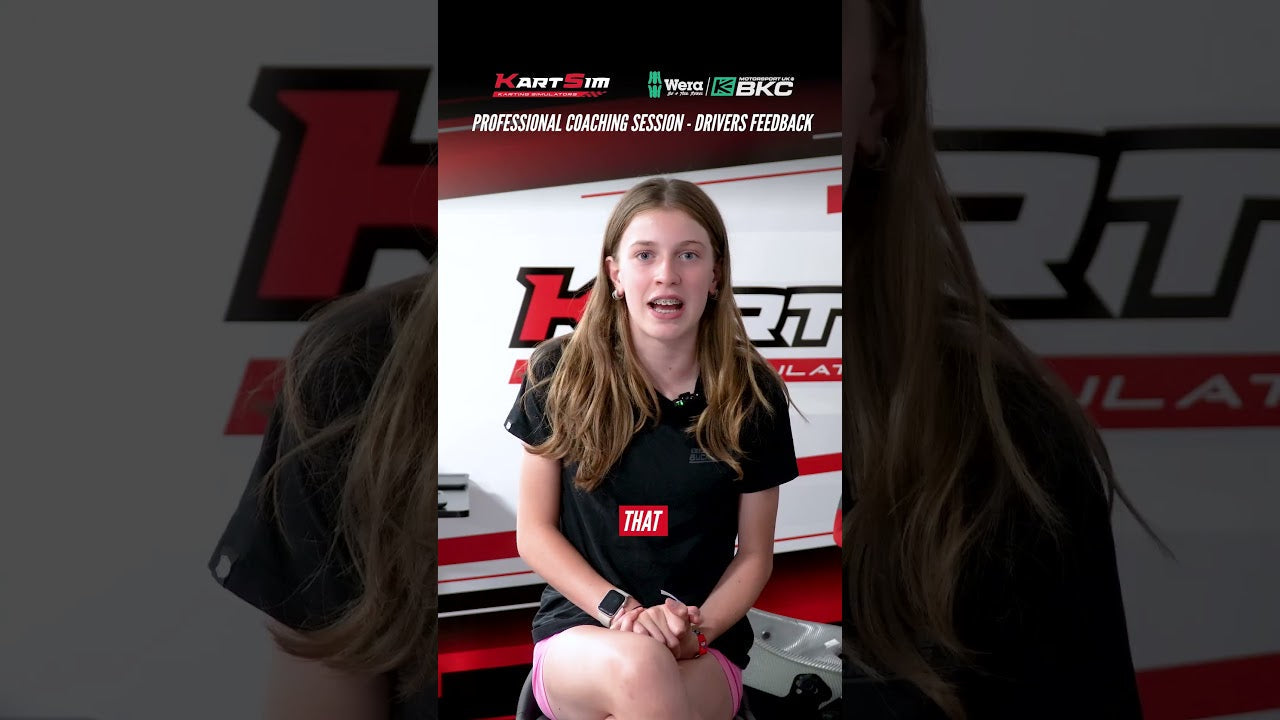 Kart driver shares feedback during professional coaching session at KartSim simulator training facility