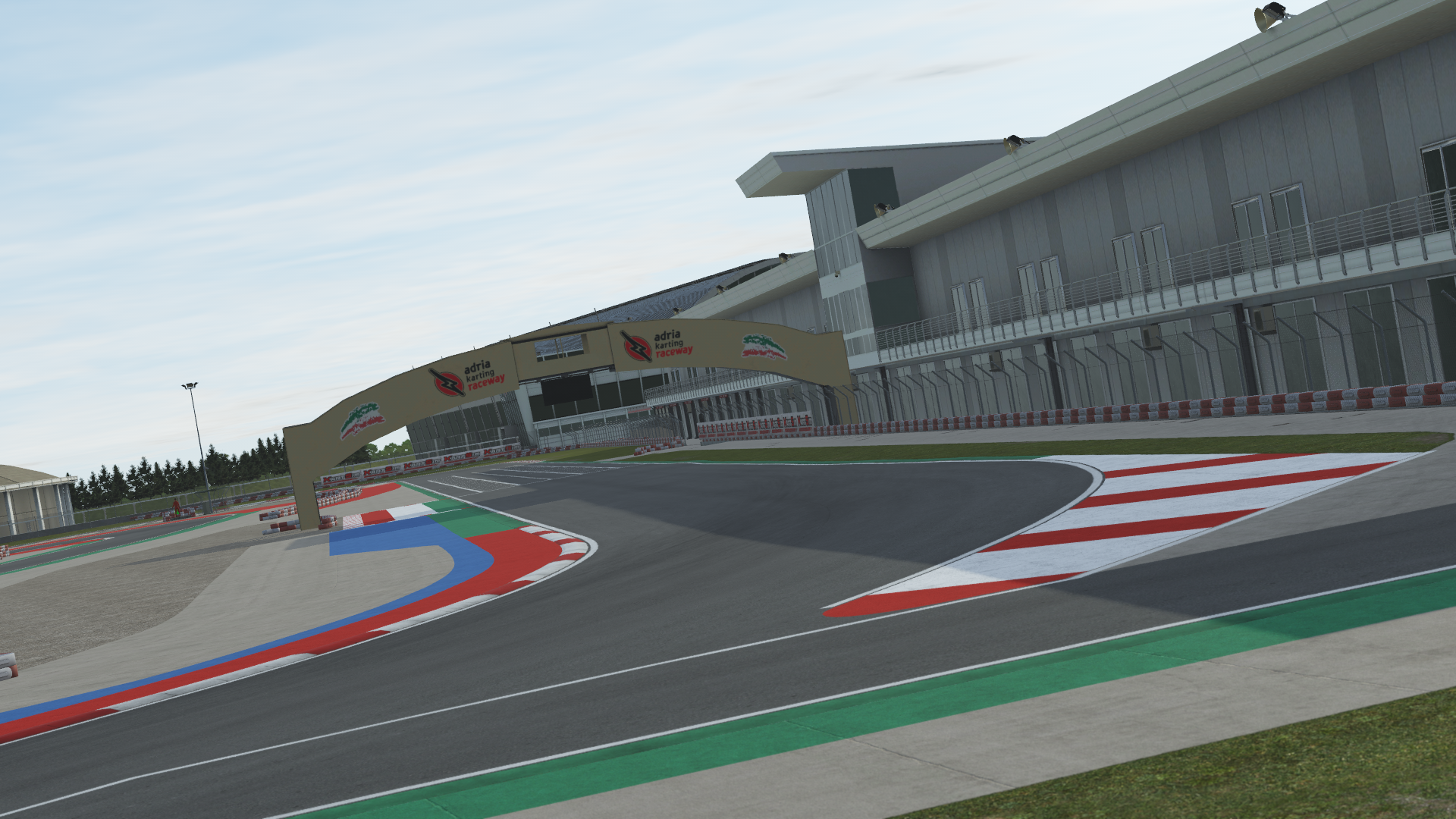 KartSim Adria simulation – race control tower and pit lane infrastructure rendered in karting software for elite-level race prep