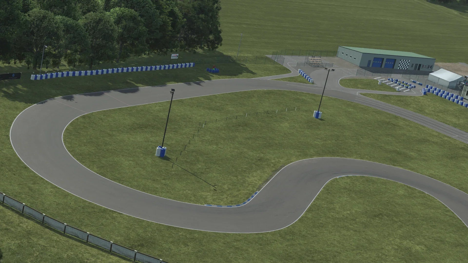 KartSim Essay circuit – wide-angle simulation software render showing elevation and facility structures for immersive driver preparation