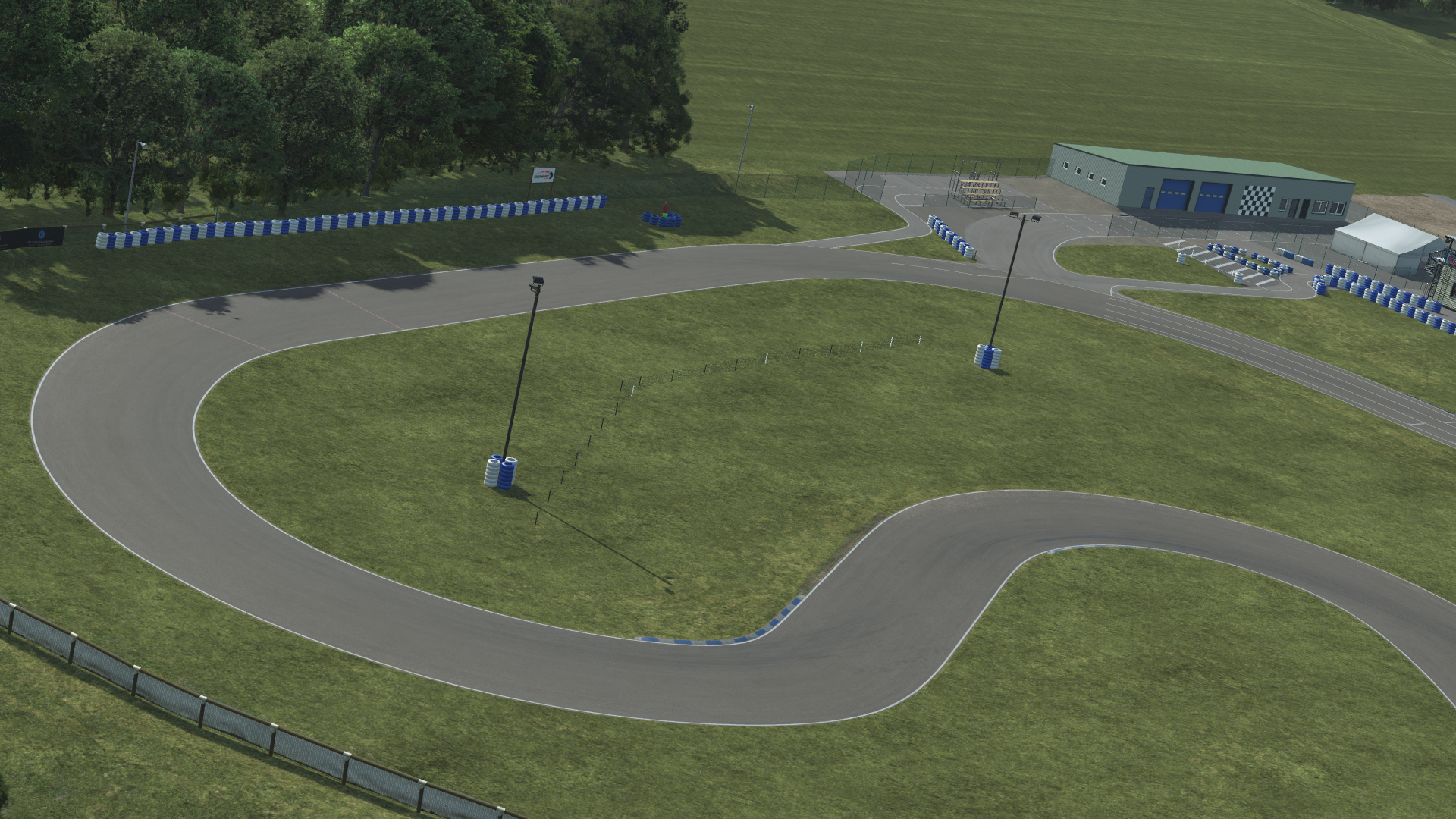 KartSim Essay circuit – wide-angle simulation software render showing elevation and facility structures for immersive driver preparation
