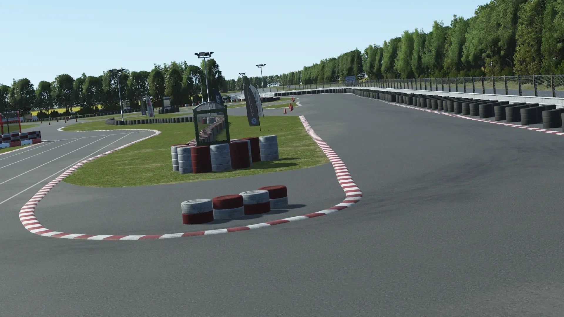 Technical infield section of Llandow in KartSim – Precision-rendered KartSim view of Llandow’s tight infield turns, featuring tyre wall barriers, grass inlays, and authentic trackside details.