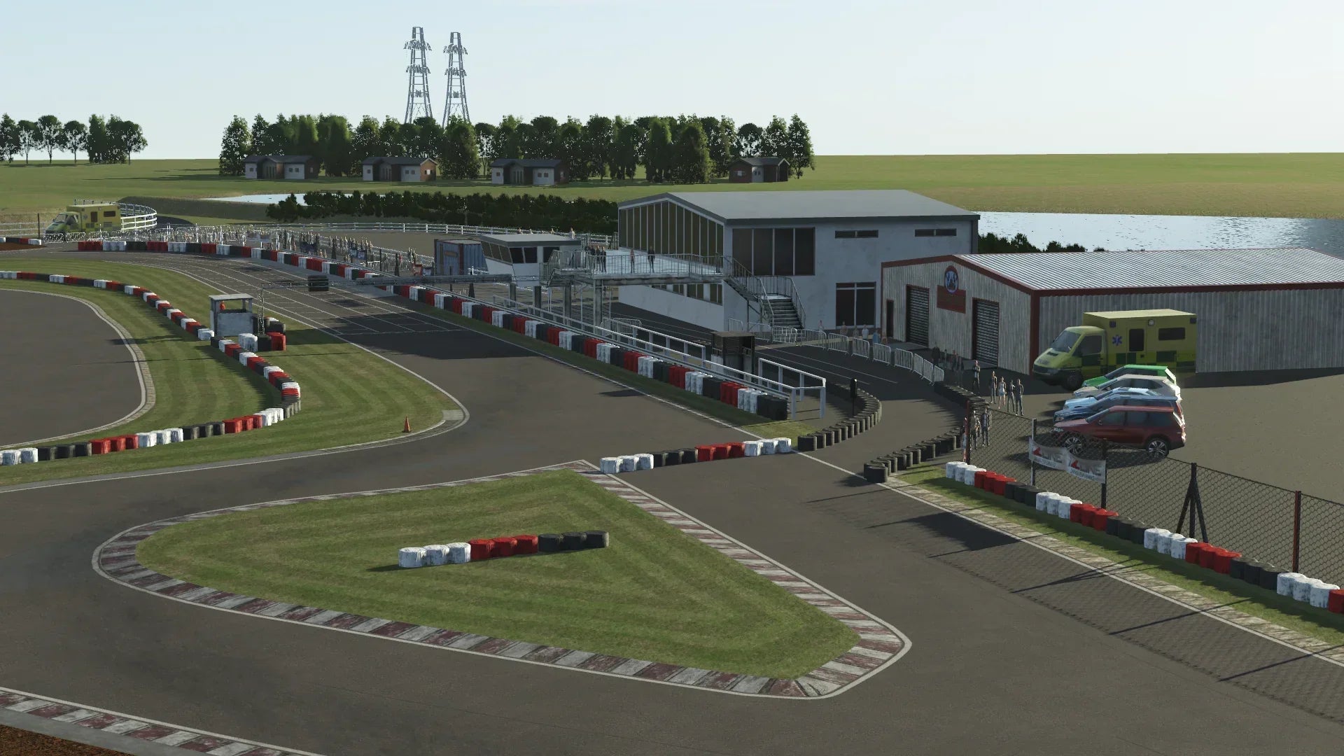 Close-up of Lydd’s pit lane and paddock facilities within the KartSim software, highlighting realistic structures and pit activity.