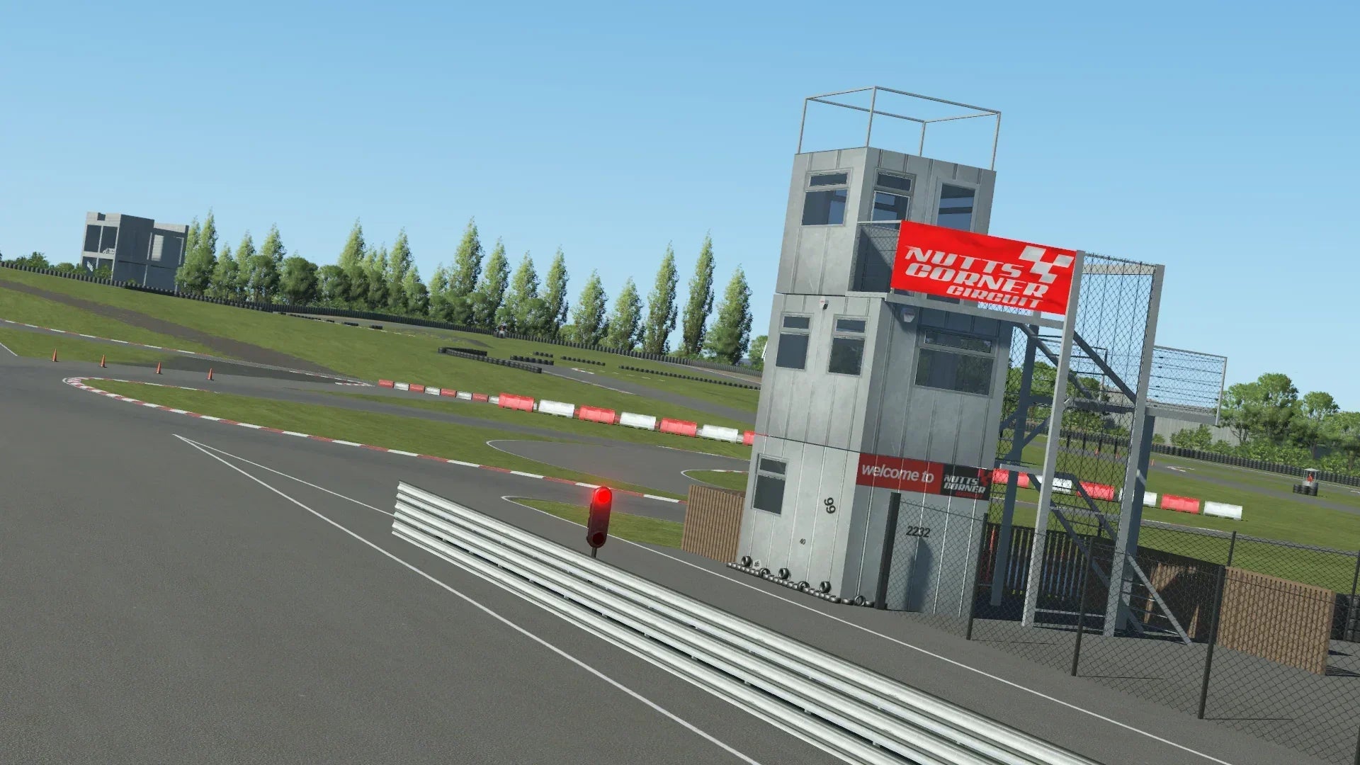 KartSim Nutts Corner Control Tower – Trackside control tower at KartSim’s Nutts Corner circuit, complete with race signage and a view over the start/finish area.
