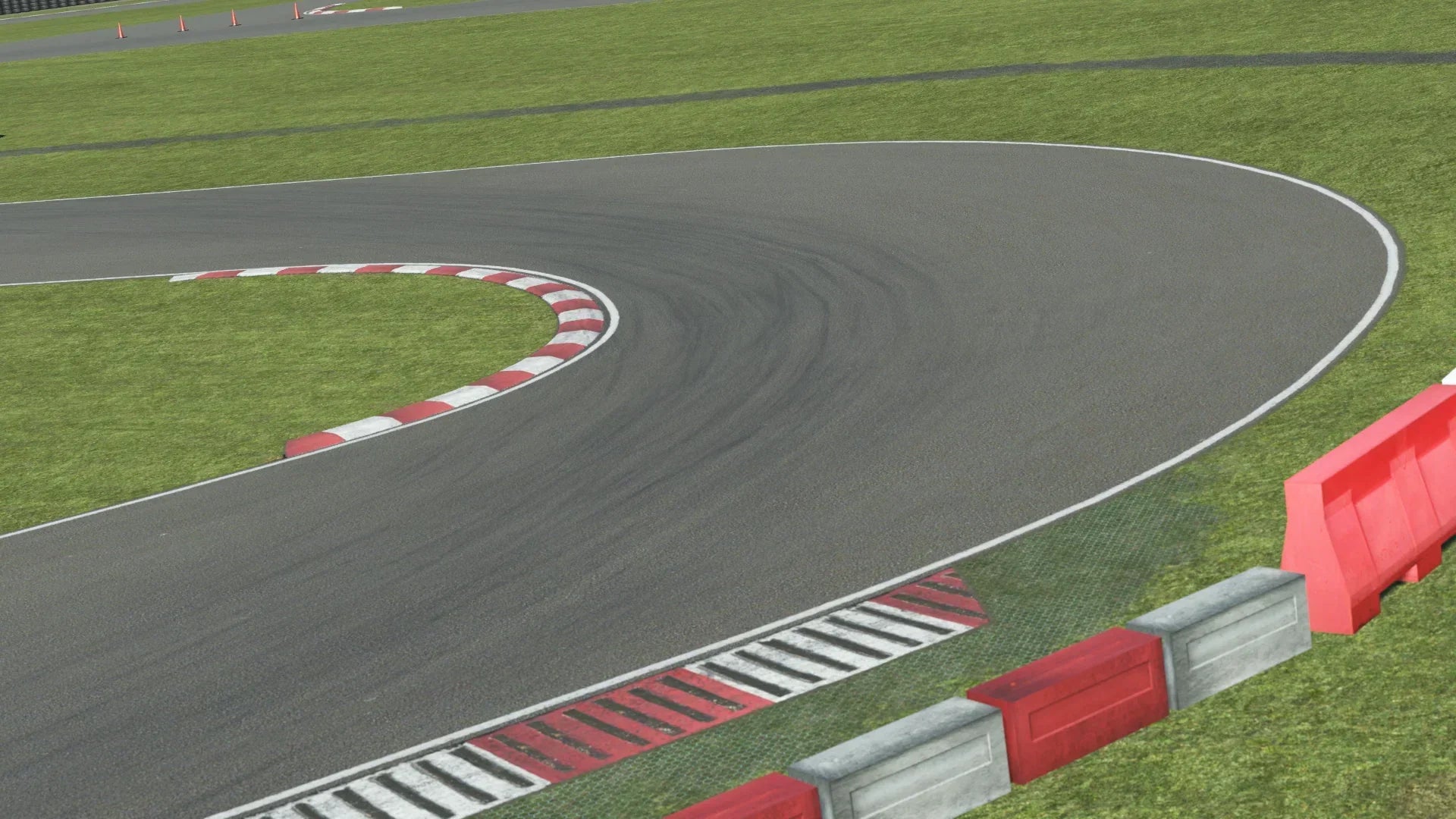 KartSim Nutts Corner Track Close-Up – Detailed view of a KartSim-rendered corner at Nutts Corner, showing the racing line, red-and-white curbs, and protective barriers.
