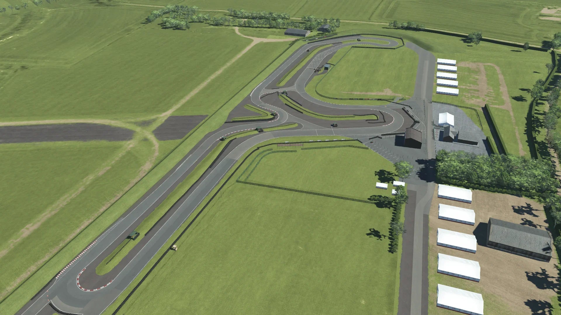 High-angle visual of Shenington's full circuit layout with clear corner geometry and paddock structures, as seen in KartSim Pro.