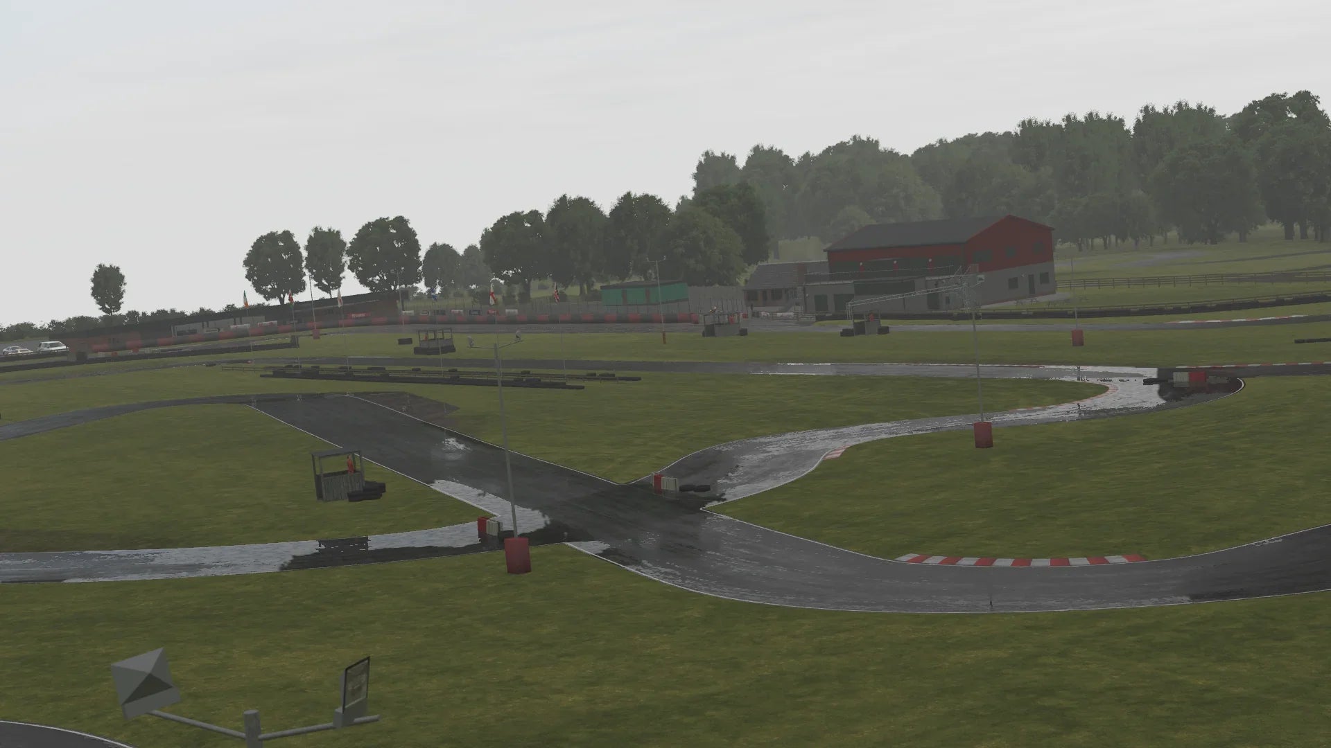 KartSim Whilton Mill wet weather aerial – Overhead view of the Whilton Mill circuit in rainy conditions within KartSim, with glistening wet tarmac and puddles.