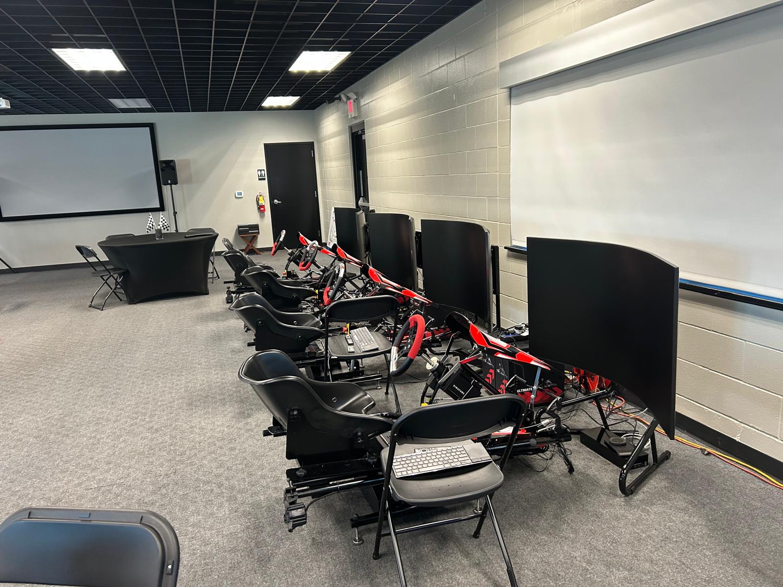 A row of KartSim Pro Simulators in a training facility, ideal for driver development programs, esports events, or corporate karting experiences.