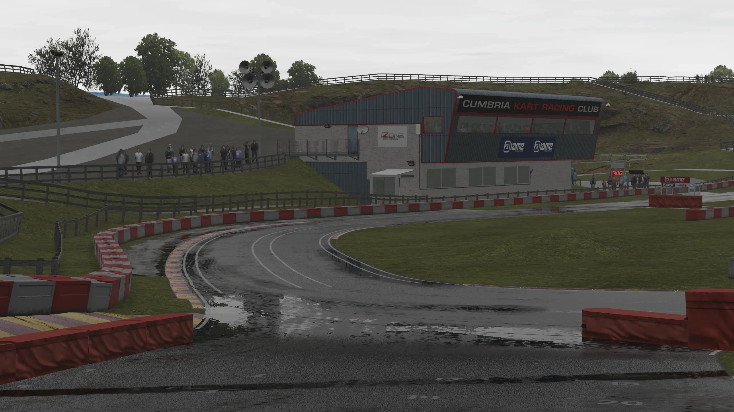 Rain-soaked corner at Rowrah rendered in KartSim Pro UK, capturing wet-weather racing conditions.