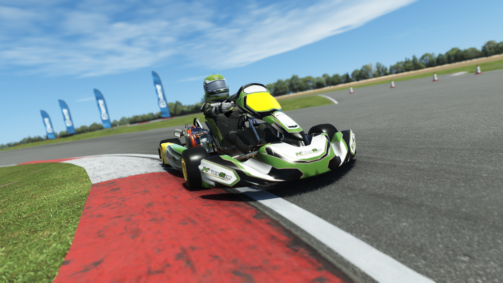 Briggs 206 Junior 006 kart with green, white, and black design shown on KartSim software racing on kart track with tire barriers