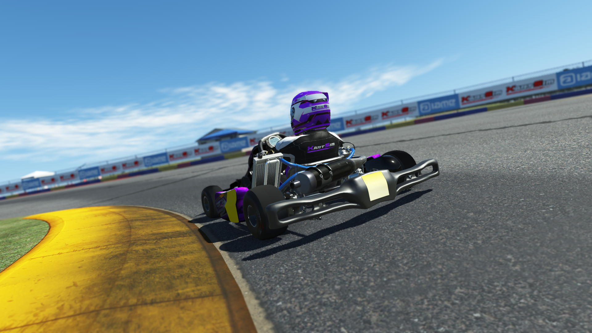 IAME Swift Cadet 004 kart with purple and white design shown on KartSim software racing on kart track with tire barriers