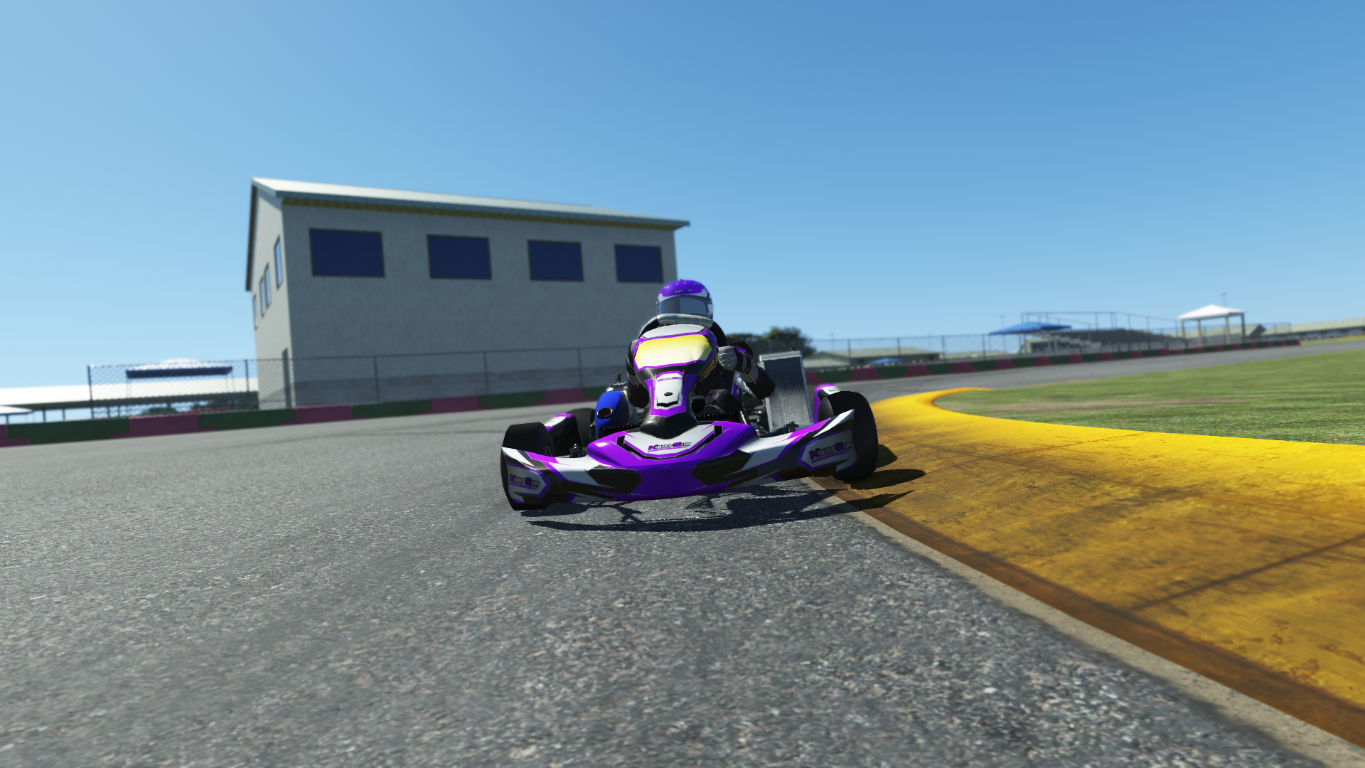 IAME Swift Cadet 006 kart with blue and white livery shown on KartSim software racing on kart track with tire barriers