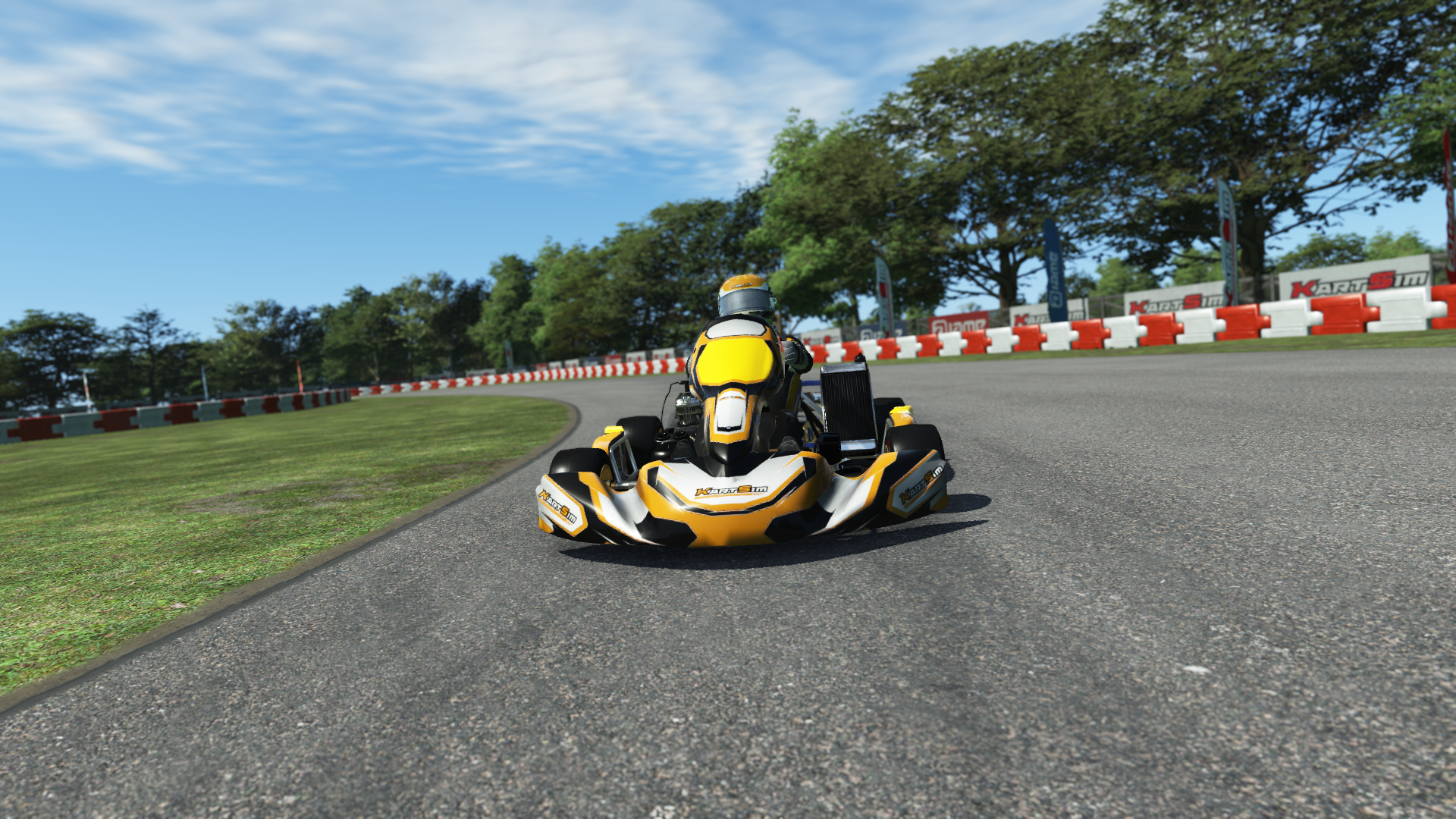IAME X30 Senior US 003 kart with blue and yellow livery shown on KartSim software racing on kart track with tire barriers