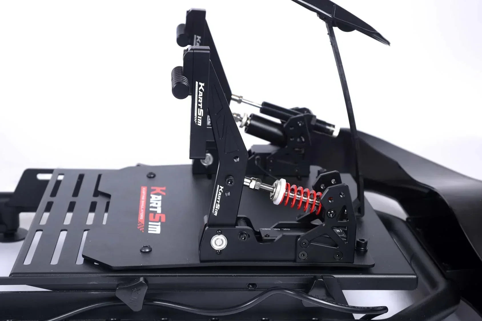 KartSim custom-engineered load cell pedal system with adjustable resistance and hydraulic dampers for realistic karting simulation and precision braking control