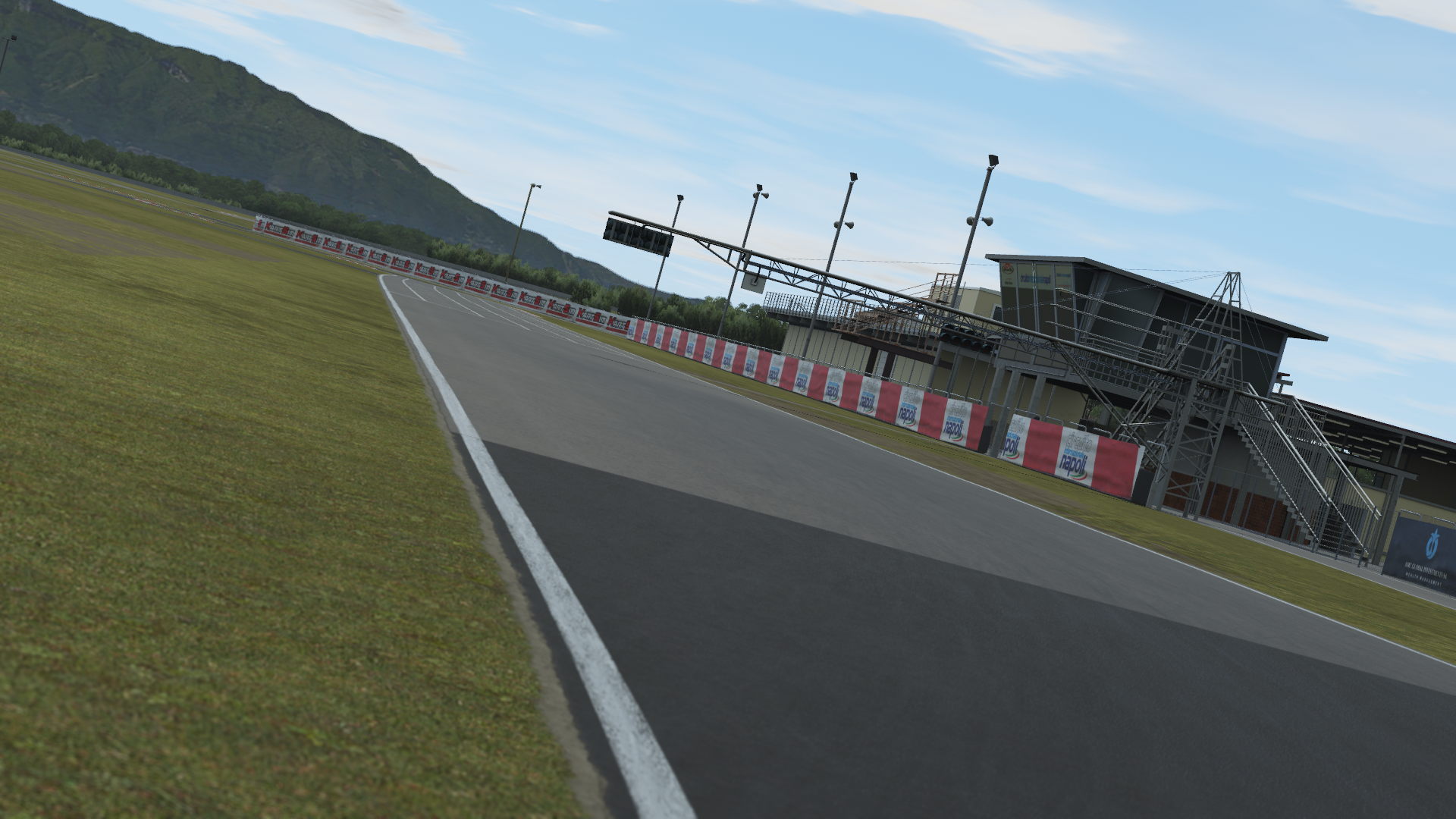 Aerial view of Sarno Racing Circuit featuring winding track layout and pit buildings, displayed in KartSim kart racing simulation software