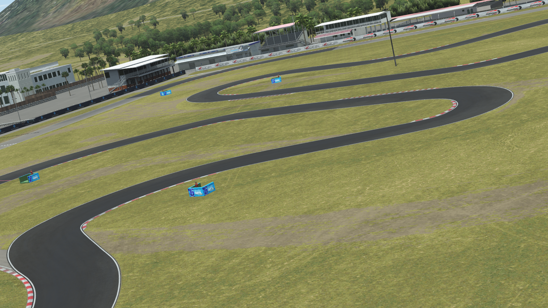 Aerial view of Sarno Racing Circuit with detailed asphalt track and pit buildings, featured in KartSim kart racing simulator software