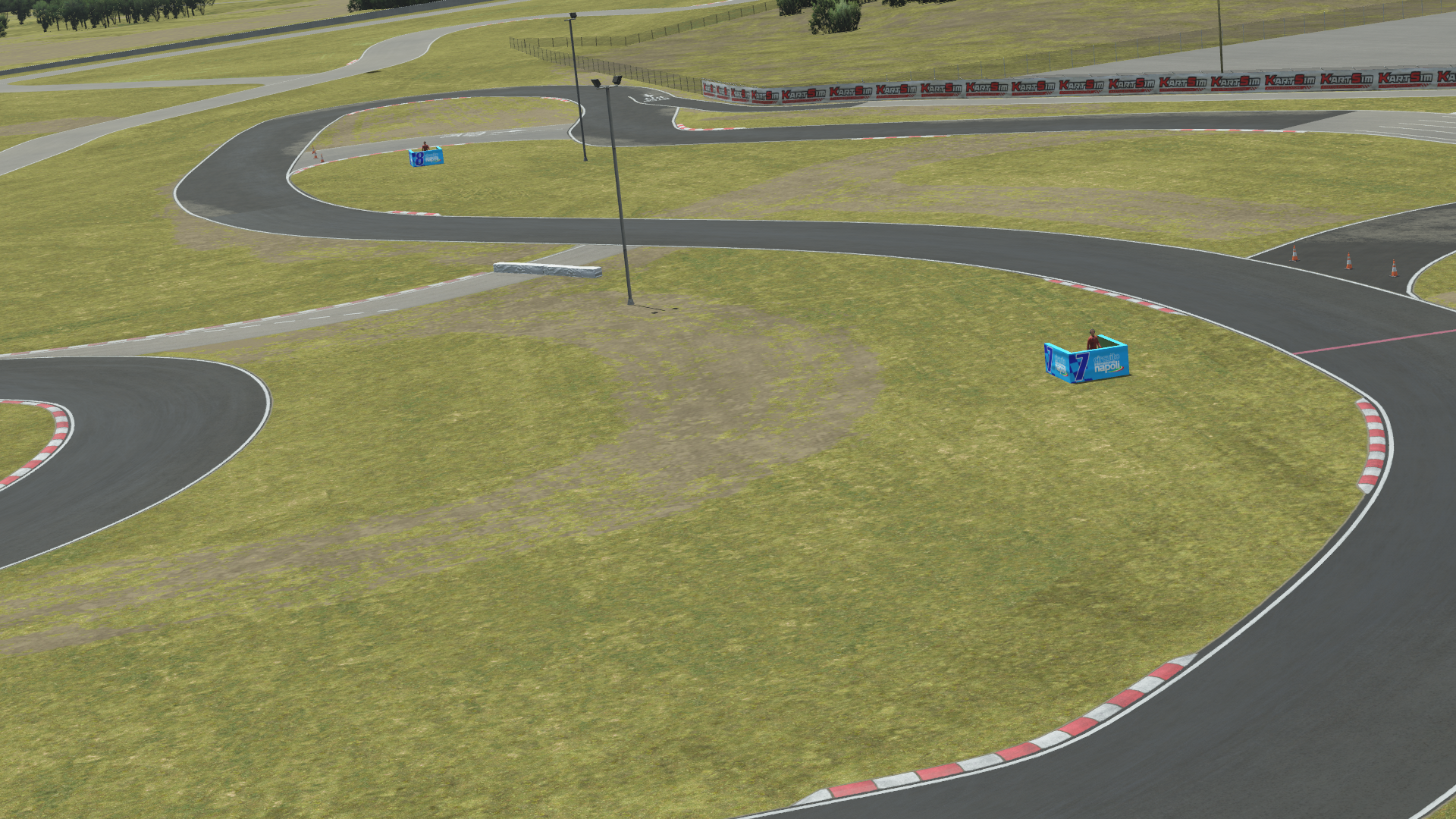 Detailed aerial view of Sarno Racing Circuit with pit buildings and track layout, showcased in KartSim kart racing simulation software
