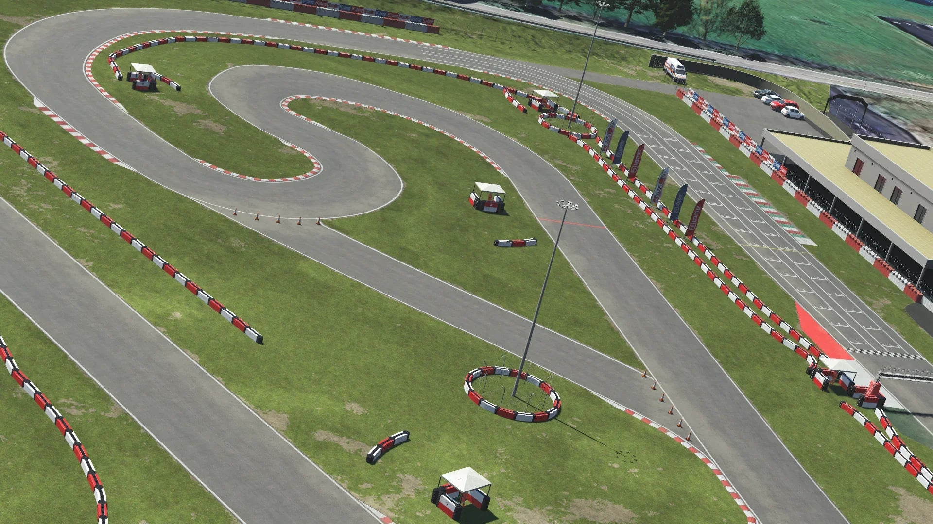 Aerial view of Viterbo kart racing circuit featuring tight corners and barriers, displayed in KartSim kart racing simulation software