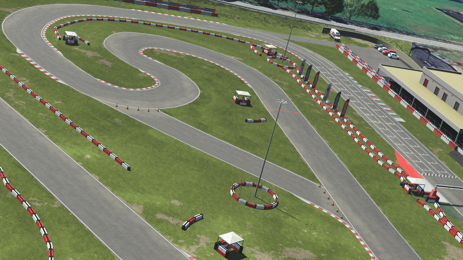 Aerial view of Viterbo kart racing circuit featuring tight corners and barriers, displayed in KartSim kart racing simulation software