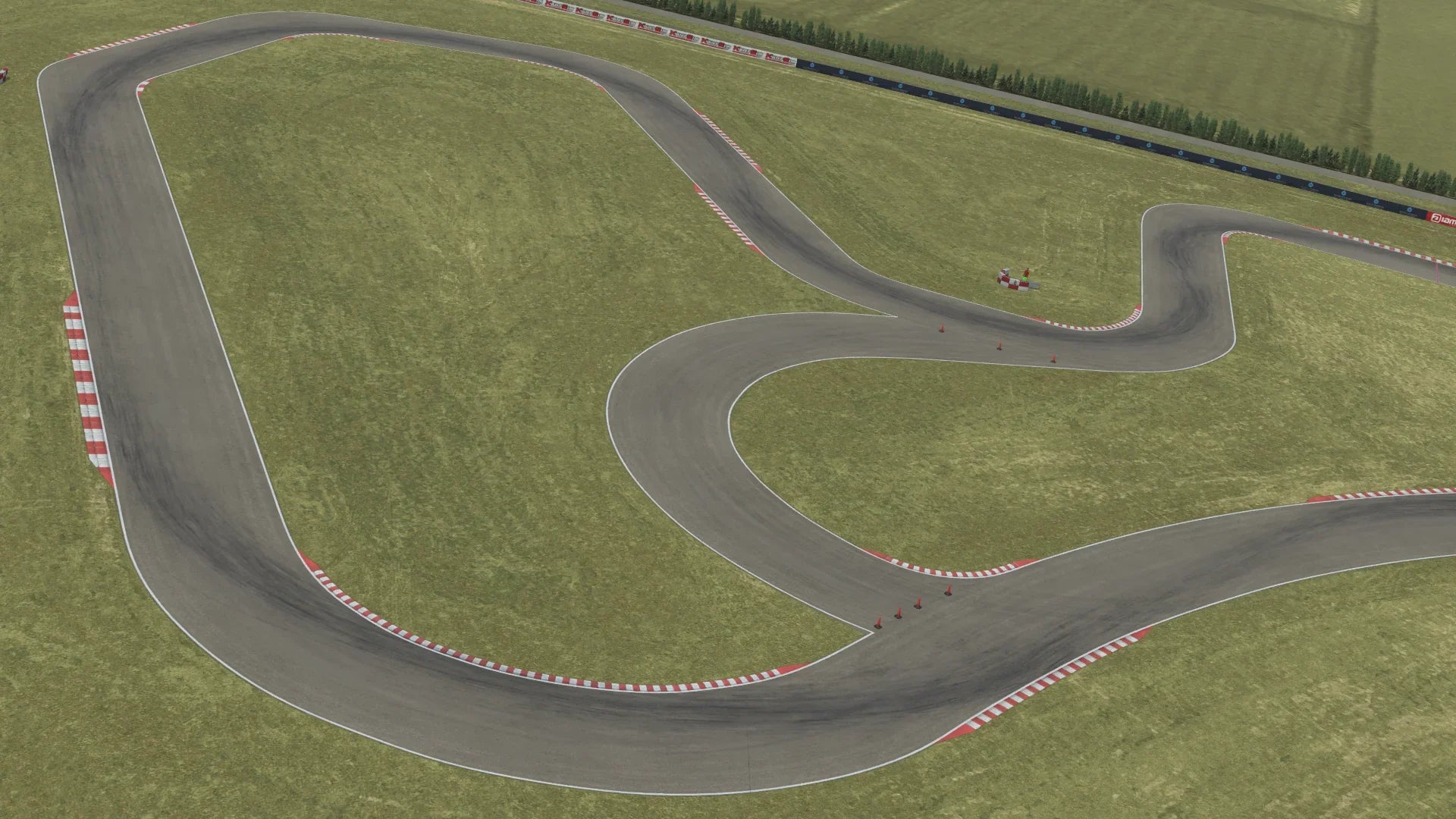 Aerial view of Zuera kart racing circuit with multiple curves and grassy surroundings in KartSim kart racing simulation software