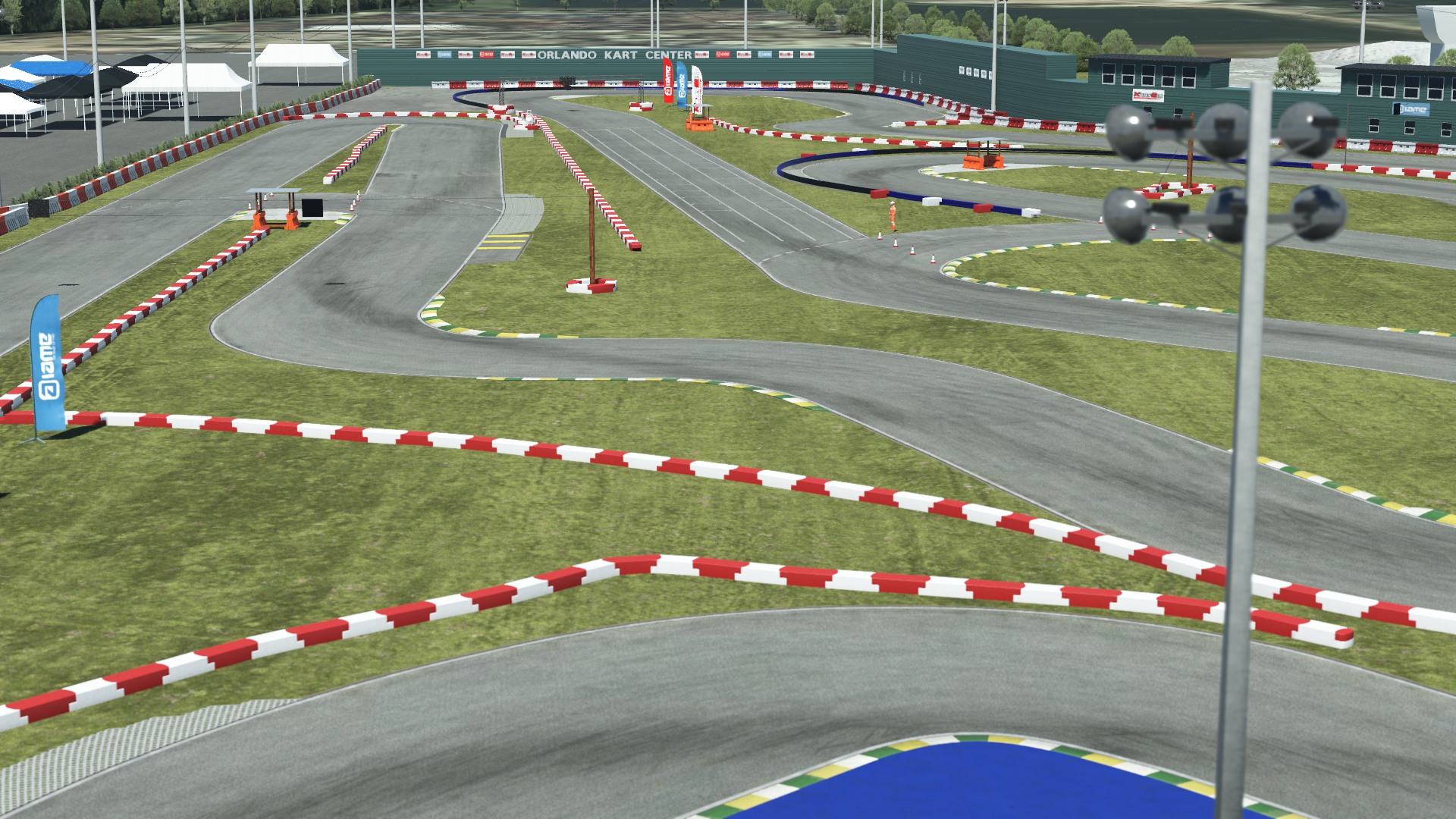 Orlando kart track layout with tight corners, safety barriers, and grass in a professional racing complex